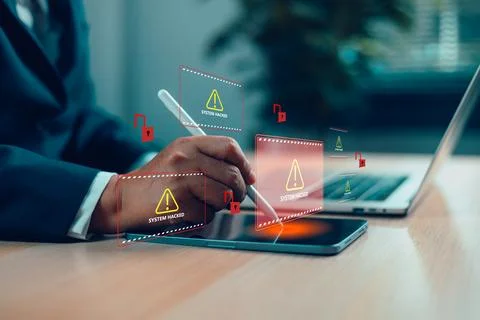 Businessman using digital tablet with system hacked alert on virtual screen.. Stock Photos