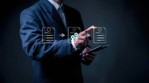 Businessman using digital tablet with virtual icons Stock Photos