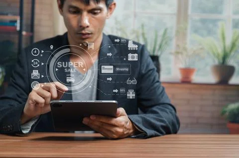 Businessman Using Digital Tablet with Virtual E-Commerce and Technology Icons Stock Photos