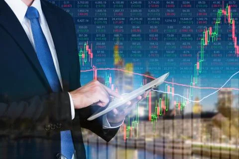 Businessman using digital tablet working with stock market chart in computer  Stock Photos