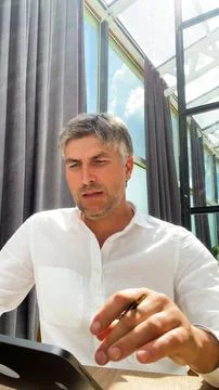 Businessman using a digital tablet , working with documents . Stock Photos