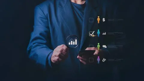 Businessman using digital touch screen with charts and icons Stock Photos