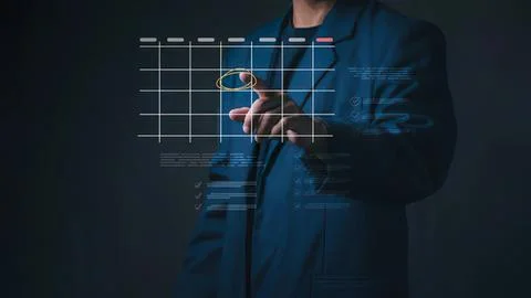 Businessman using futuristic digital interface with holographic charts Stock Photos