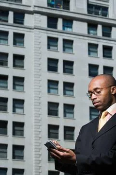Businessman using handheld computer Stock Photos