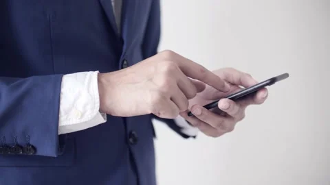 Businessman using his smartphone during a meeting Stock Footage 239019078