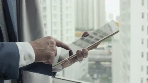 Businessman using his tablet in the office Stock Footage 239019532