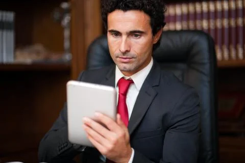 Businessman using his tablet Stock Photos