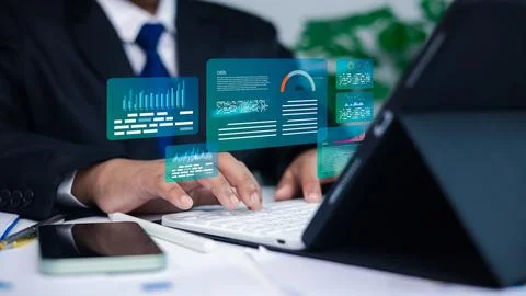 Businessman using hologram data analytics interface on tablet computer for .. Stock Photos