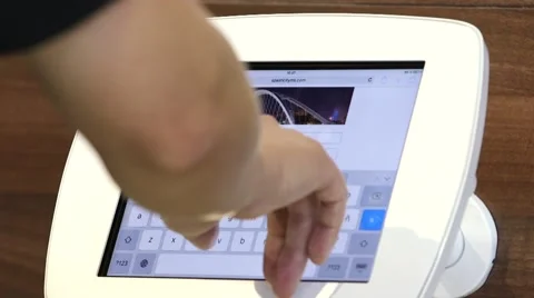 Businessman using an iPad touchscreen at a corporate event Stock Footage 56370796