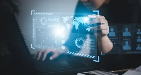 Businessman using a laptop with Analytics and Data Management System on the c Stock Photos