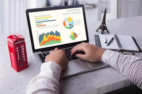 Businessman using laptop analyzing statistics data on laptop screen Stock Photos