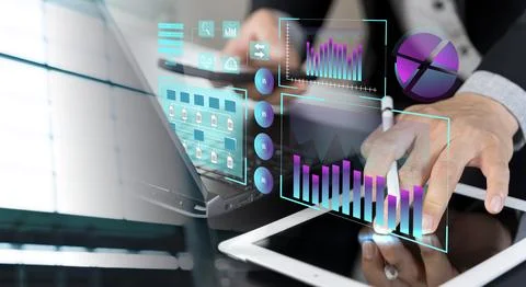 Businessman using laptop computer analyzing sales data and financial growth.. Stock Photos