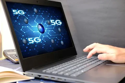 Businessman using a laptop computer and technology network concepts Stock Photos