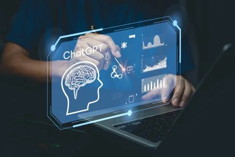 Businessman using laptop computer chatting with a smart AI or artificial in.. Stock Photos