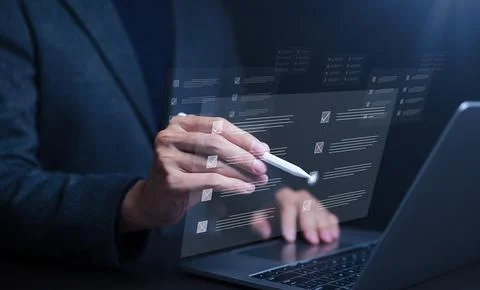 Businessman using laptop computer. doing online checklist survey, Stock Photos