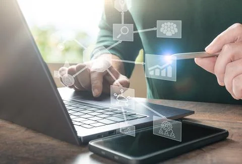 Businessman using laptop computer with global network connection, Business In Stock Photos