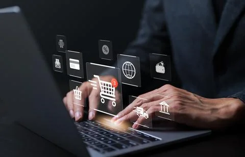 Businessman using laptop computer to input order with icons shopping. Foto stock