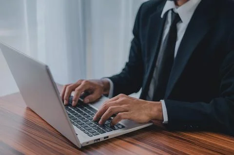 Businessman using laptop computer in office smart technology Stock Photos