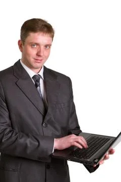 Businessman using laptop computer Stock Photos