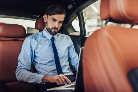 Businessman using laptop computer Stock Photos