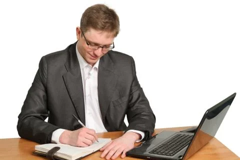 Businessman using laptop computer smiling isolated on white Stock Photos
