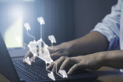 Businessman using laptop computer with virtual cloud technology with icon . Stock Photos