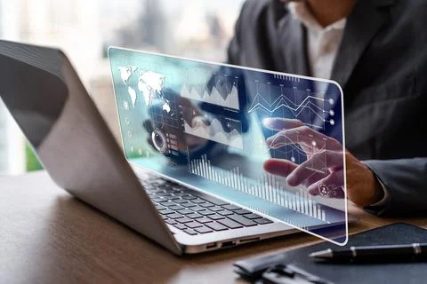 Businessman using laptop computer with a visual screen global network connection Fotos Stock