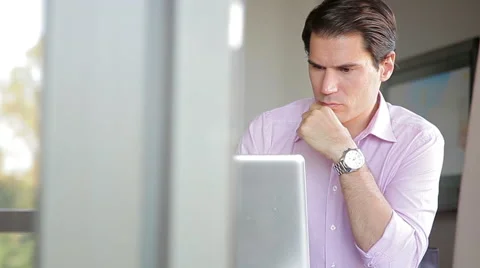 Businessman using laptop computer, working from home Stock Footage 63297567