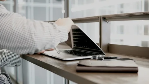 Businessman using laptop computer in working space Stock-Footage 91009916