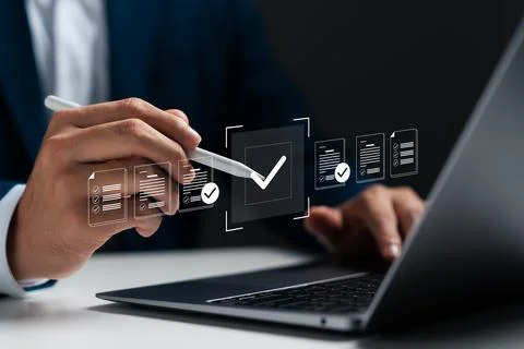 Businessman using laptop with digital document icons, check mark and online.. Stock Photos
