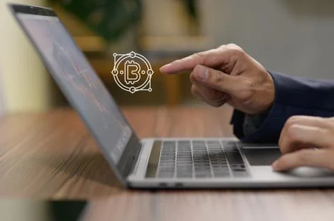 Businessman Using Laptop to Explore Bitcoin Investment Opportunities Stock Photos