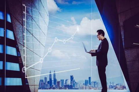 Businessman using laptop with graph statistical analysis Businessman using... Foto stock
