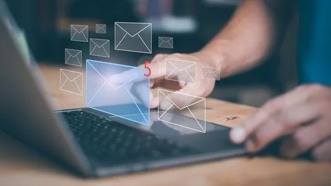 Businessman using laptop to open e-mail via virtual screen, Internet messag.. Stock Photos
