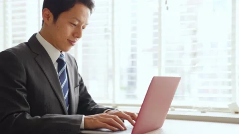 Businessman using a laptop pc in the office. Stock Footage 136721355