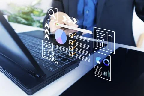 Businessman using laptop to perform data management tasks and verify work c.. Foto stock