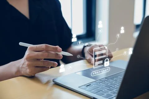 Businessman using laptop with protected document connected. Stock Photos