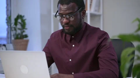 Businessman using laptop at table during working day in modern office spbas. Stock Footage 147650091