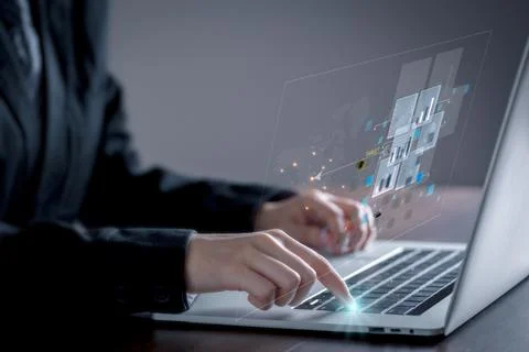 Businessman using laptop with virtual screen which show graph of the results  Stock Photos