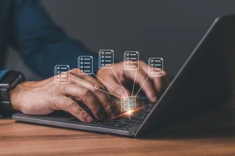 Businessman using laptop with virtual screen to backup data. Process data a.. Stock Photos