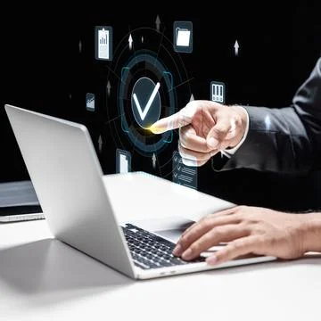 Businessman using a laptop while interacting with a digital holographic int.. Stock Photos