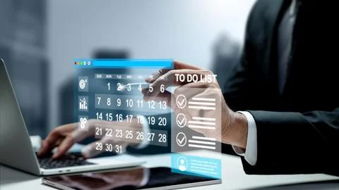 Businessman using a laptop while interacting with a futuristic holographic .. Stock Photos