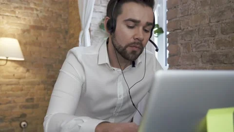 Businessman using laptop while working in a call center Video stock 233432235