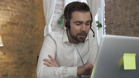 Businessman using laptop while working in a call center Video stock 233432353