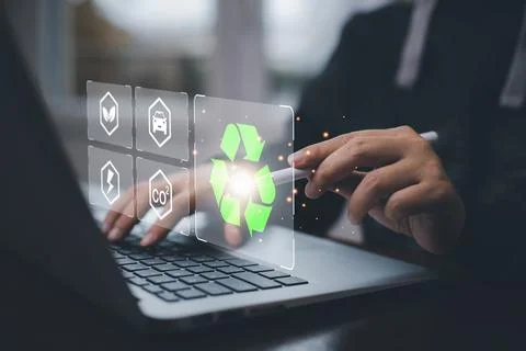 Businessman using laptops and touch recycle symbol with virtual modern reduce Stock Photos