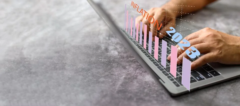 A businessman is using laptops in hyperinflation situations around the worl.. Stock Photos