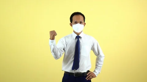 A businessman using a mask for protect an air toxic.  Stock Footage 123777805