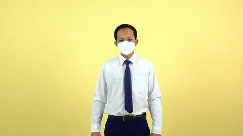 A businessman using a mask for protect an air toxic.  Stock Footage 123777989