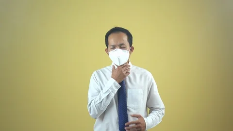 A businessman using a mask for protect an air toxic.  Stock Footage 123778171