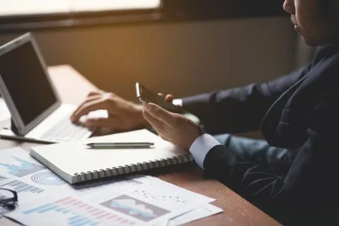 Businessman using mobile and working on desk office business Stock Photos
