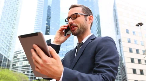 Businessman using a mobile phone Video stock 56149307